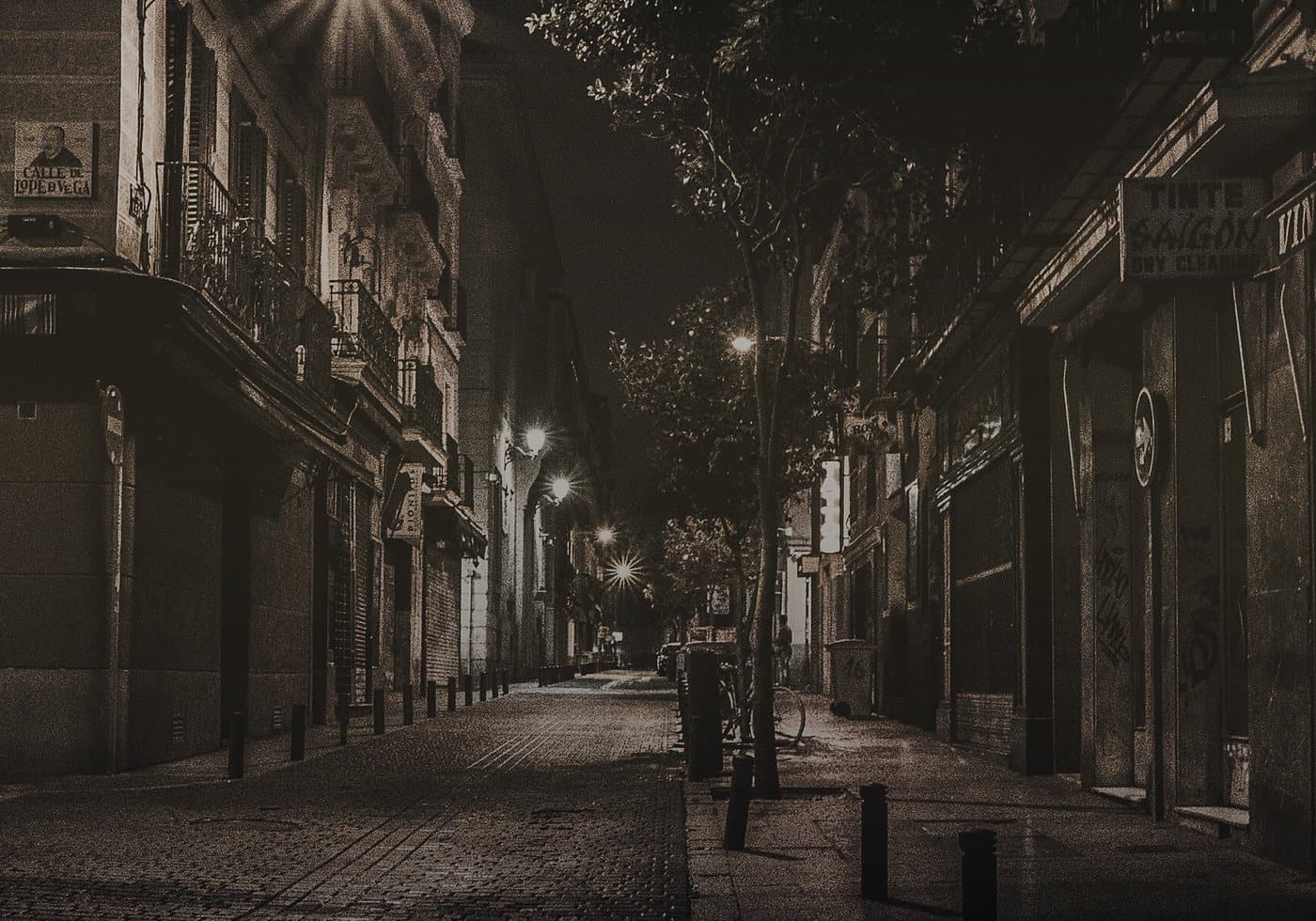 Tight night street with light islands in Cologne